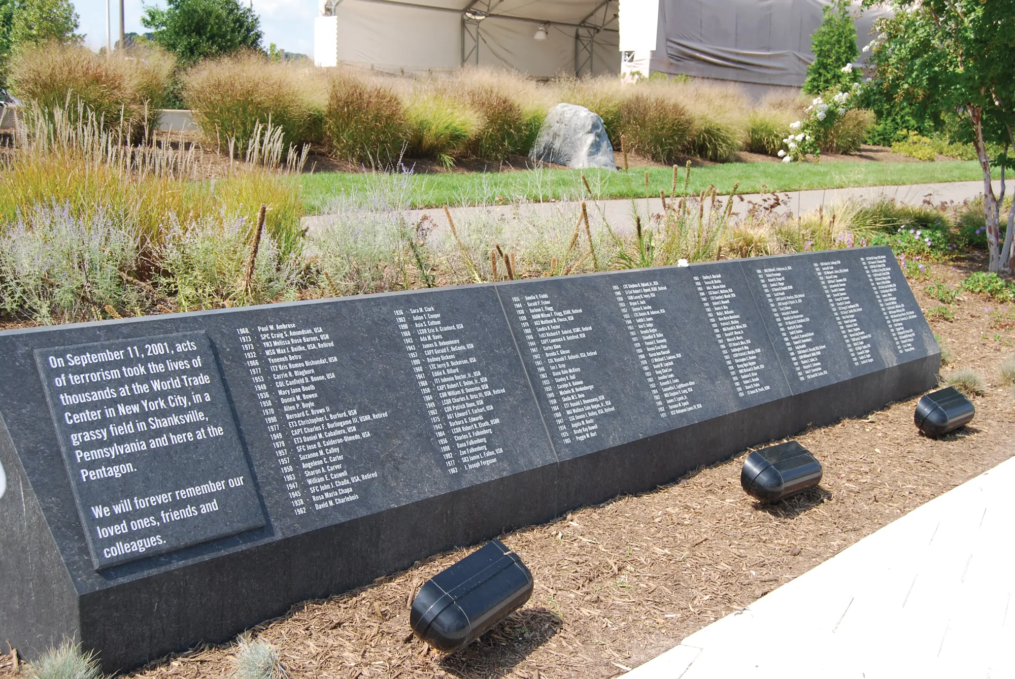 The Pentagon Memorial’s black granite name wall, the 184 victims listed by birth year beside the dedication text.