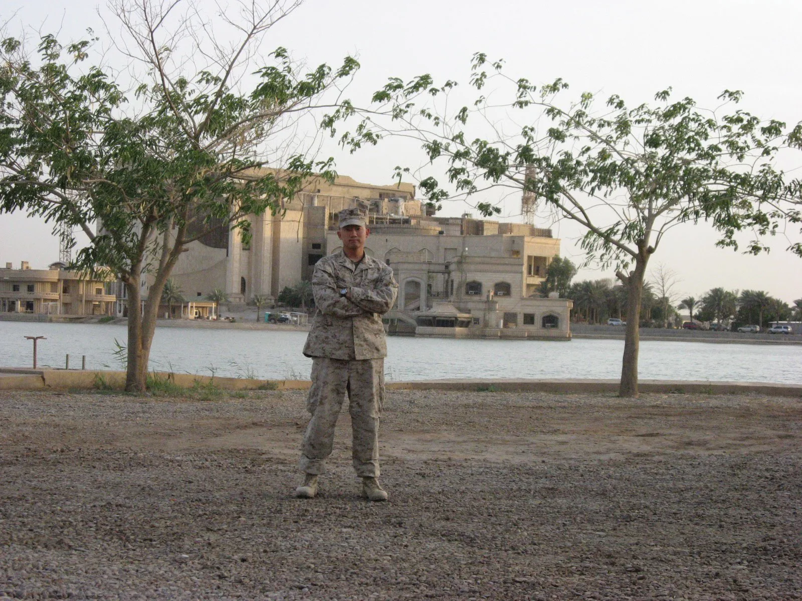 Bottom photo: Col Adam Yang ’05, USMC, in front of Saddam Hussein’s palace in Baghdad in 2008 while he was serving in the Global War on Terrorism